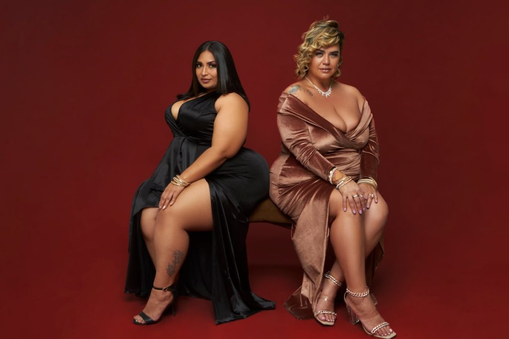 a couple of women sitting next to each other