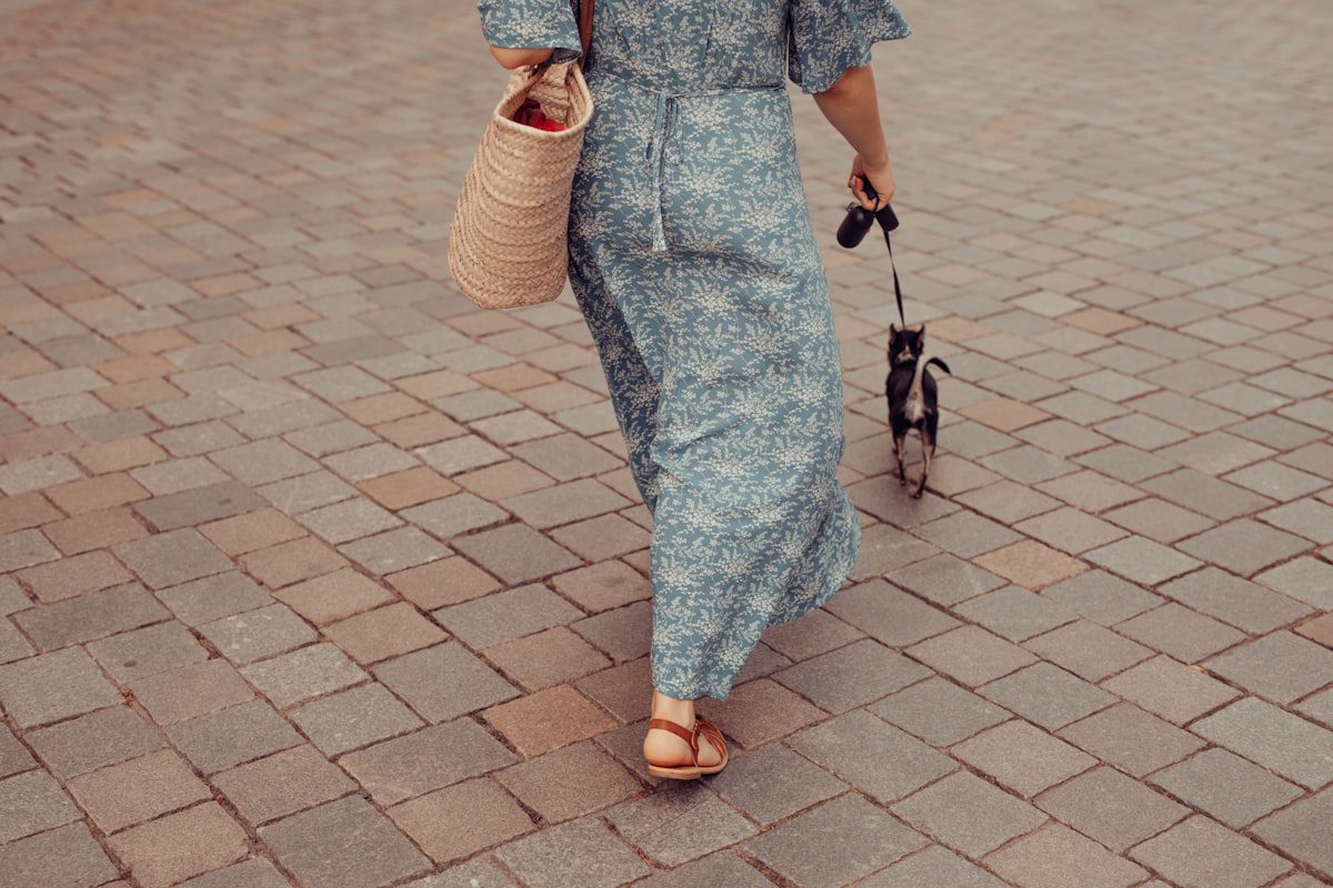 Woman in a blue and white floral dress