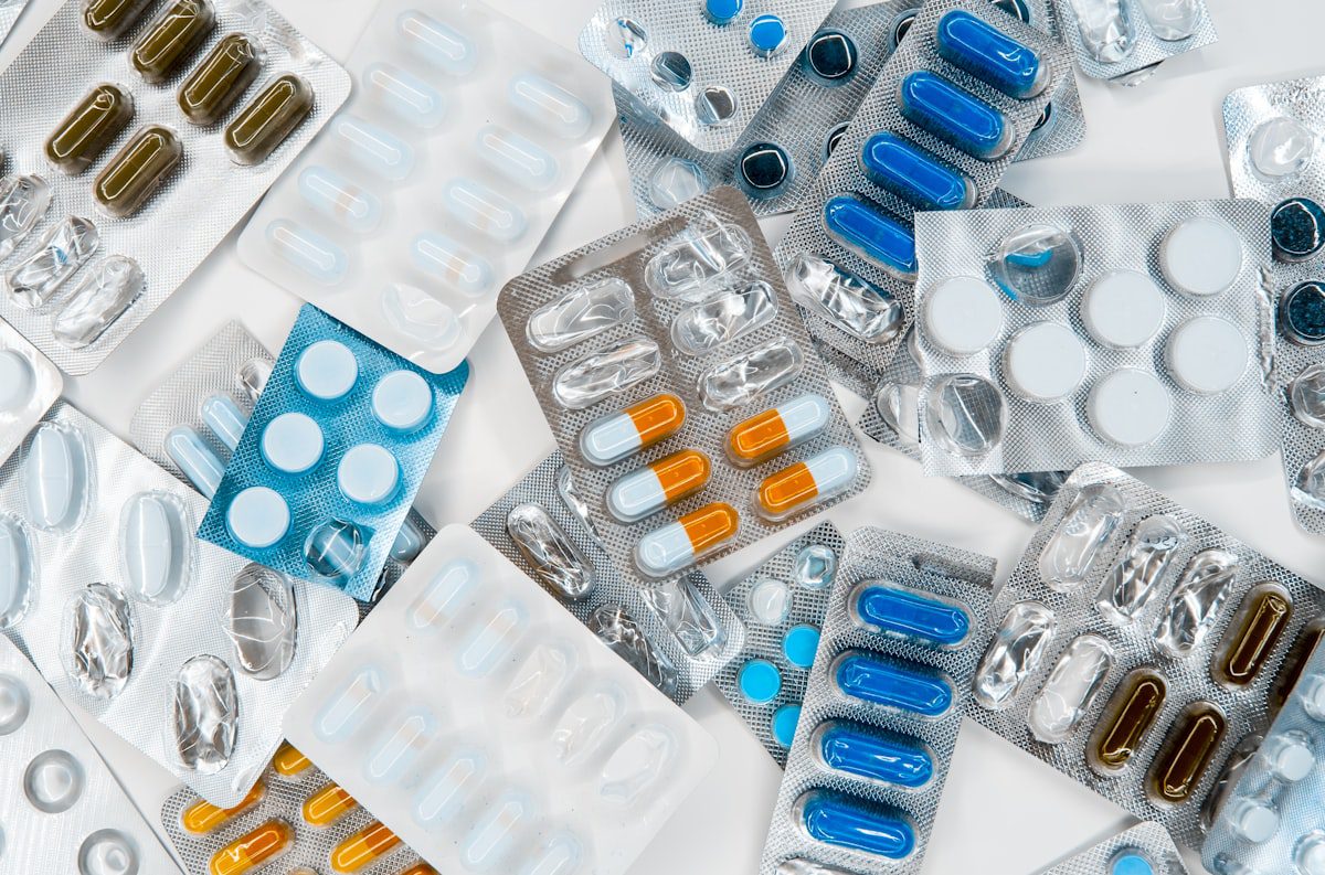 Assorted medication blister packs with pills and capsules