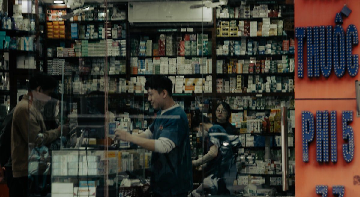 Well-stocked pharmacy with medical supplies on shelves