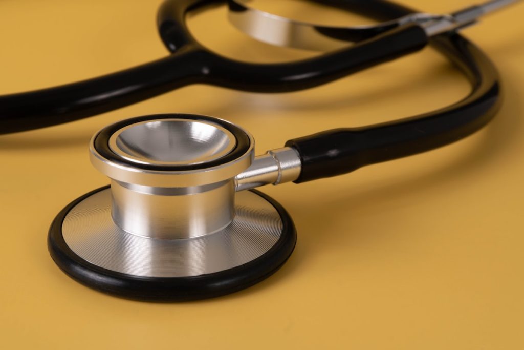 Stethoscope closeup on yellow background