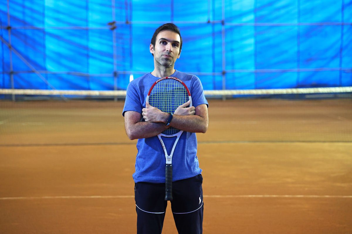 Man holding a tennis racket on court