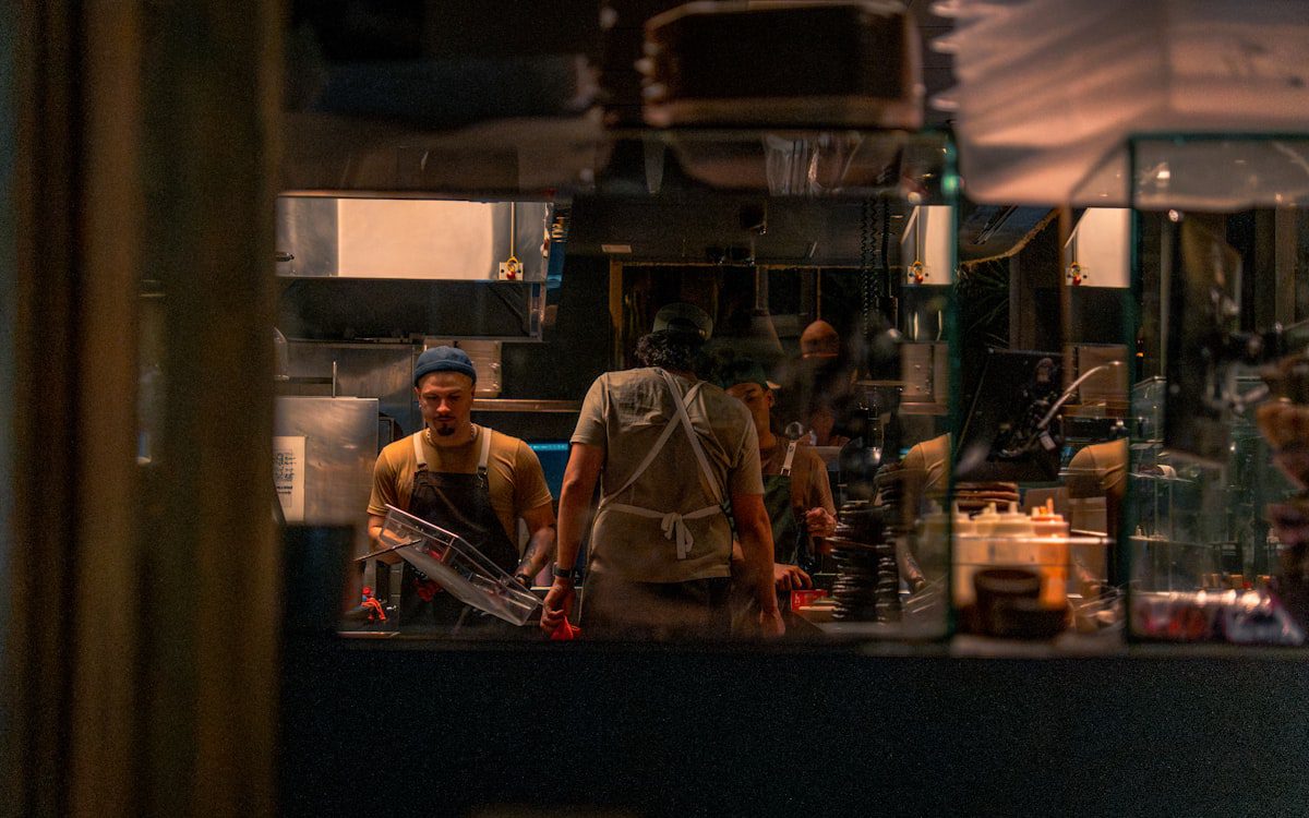 Restaurant staff working behind a busy counter