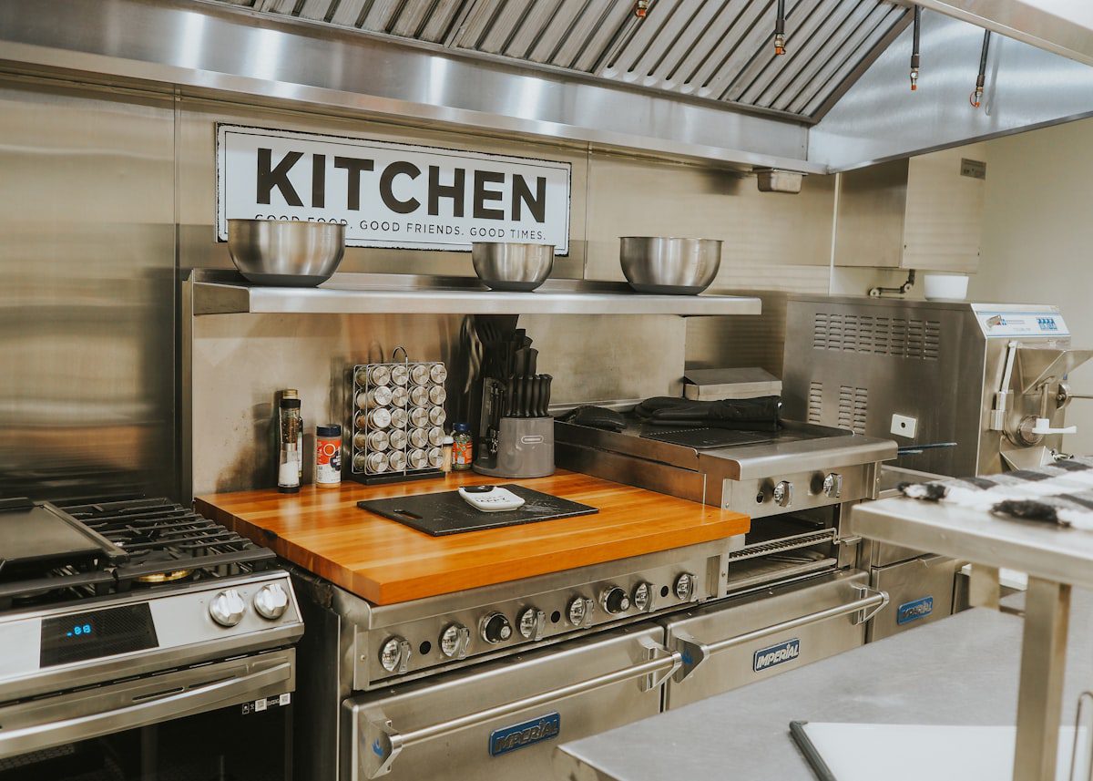 Stainless steel appliances in a modern commercial kitchen