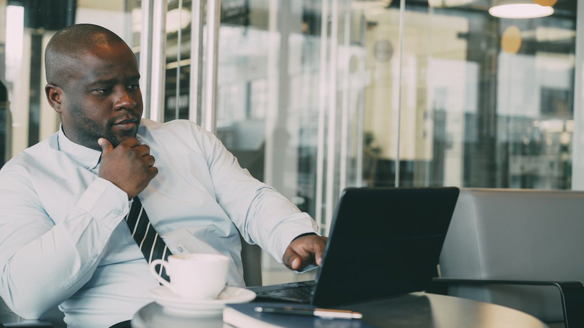 Professional working on a laptop in an office setting